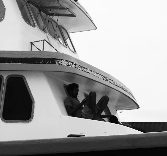 Two on a boat — photograph by Ibrahim Ifaaz, Maldives