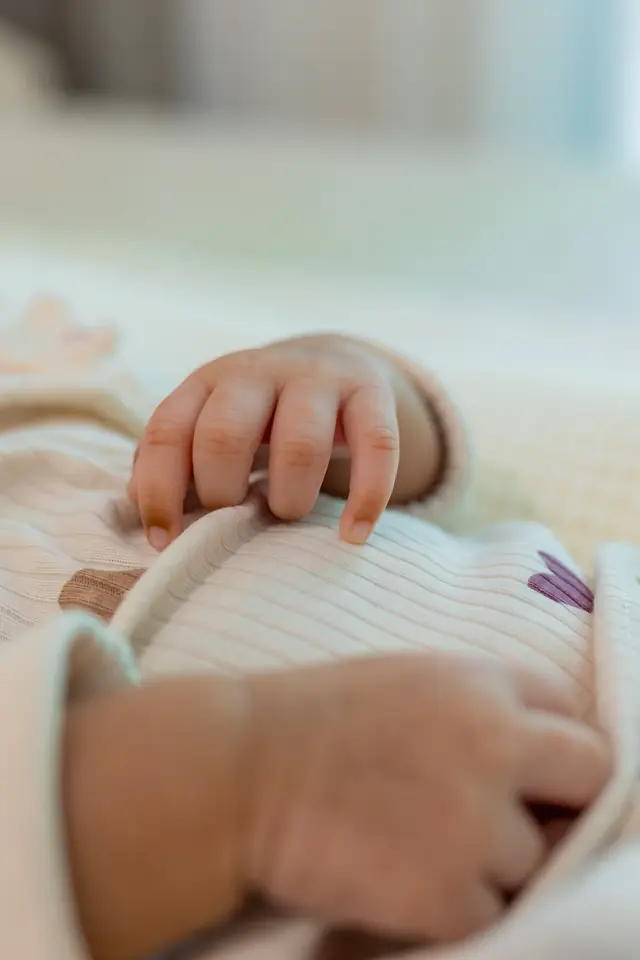A newborn's hand — photograph by Ibrahim Ifaaz